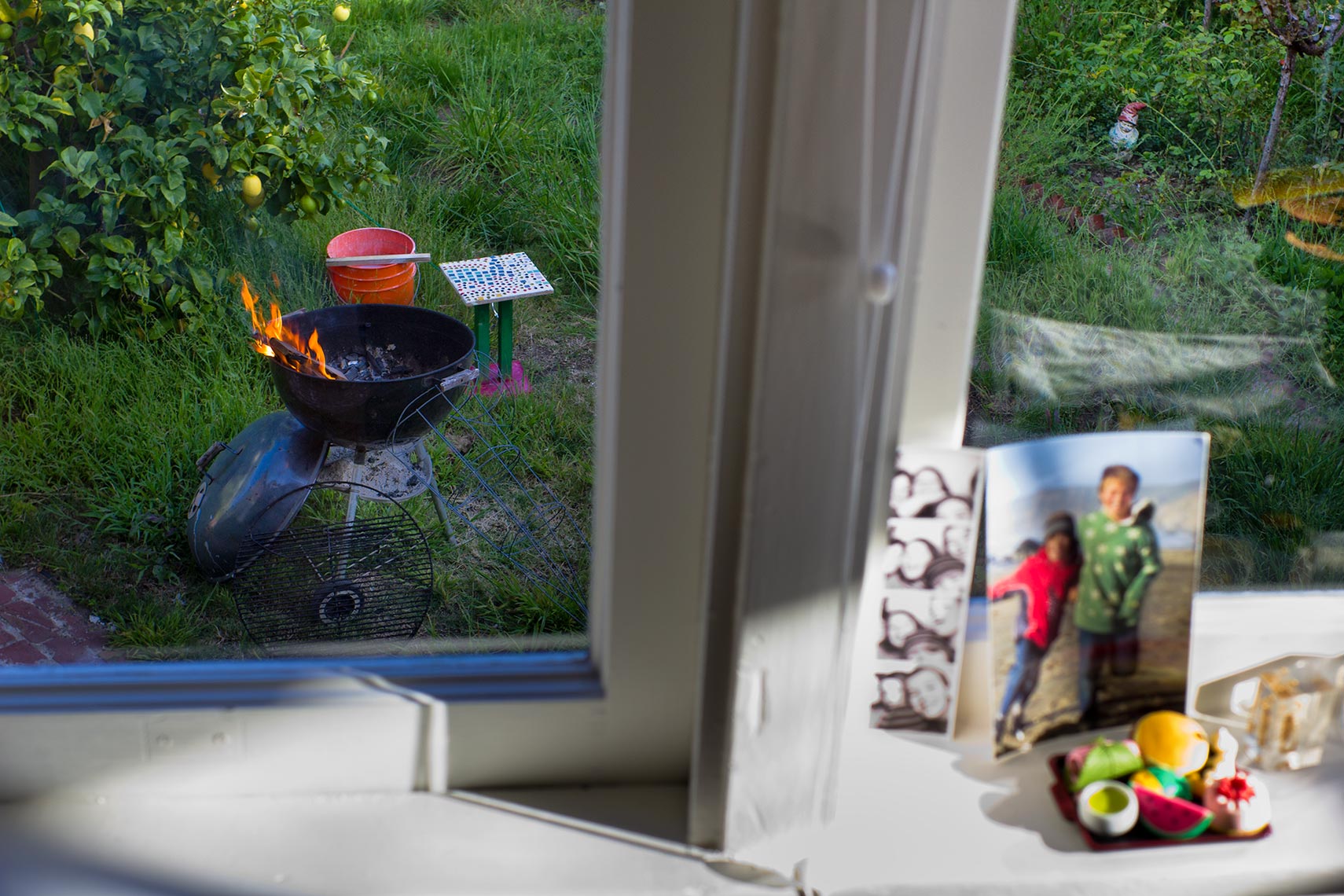Window sill stillife and barbecue