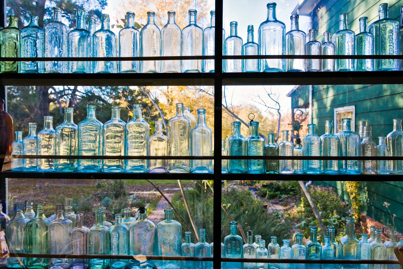 Old glass bottles in a window
