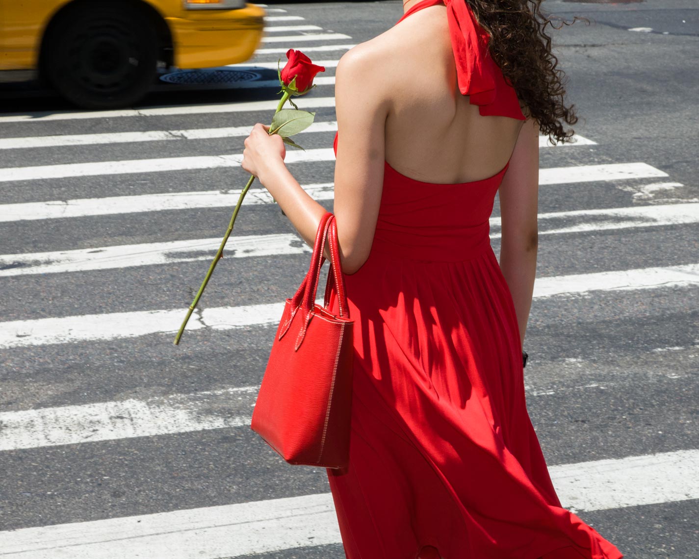 Woman in red with rose